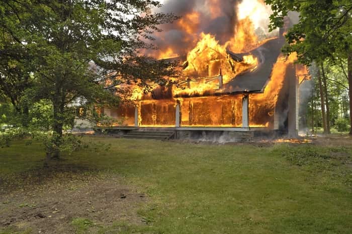 House engulfed in flames requiring fire damage restoration