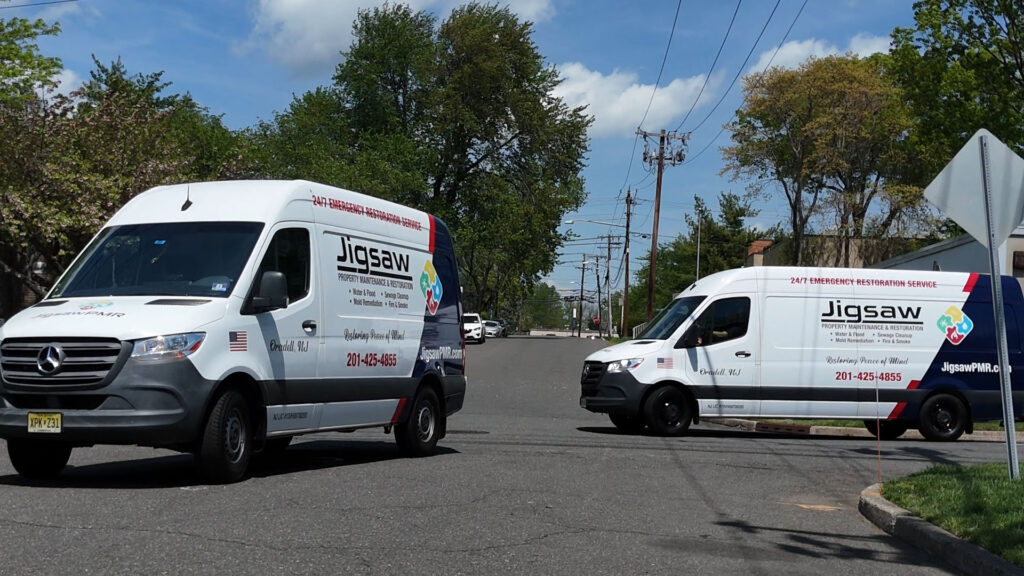 jigsaw property management and restoration trucks on their way to help a damaged home